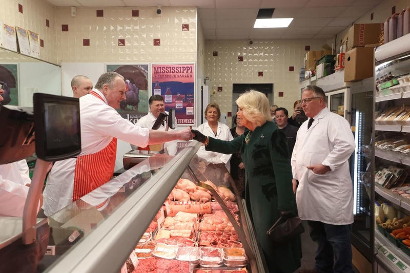 Queen Camilla meets staff at Coffey's Butchers during a visit to Lisburn Road in Belfast to meet shop owners and staff, and learn about their positive contribution to the community, during her two-day official visit to Northern Ireland.