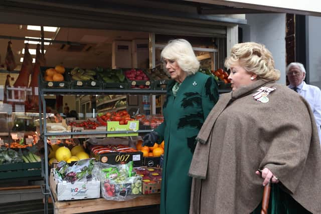 Queen Camilla with Lord-Lieutenant Dame Fionnuala Jay-O'Boyle during a visit to Lisburn Road in Belfast to meet shop owners and staff, and learn about their positive contribution to the community during her two-day official visit to Northern Ireland