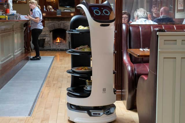 Robot waiters are being trialled at Belfast International Airport. This one, the Bellabot from Pudu, can being food from the kitchen to the table and bring dirty dishes back again.