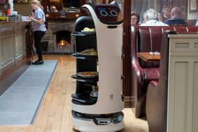 Robot waiters are being trialled at Belfast International Airport. This one, the Bellabot from Pudu, can being food from the kitchen to the table and bring dirty dishes back again.