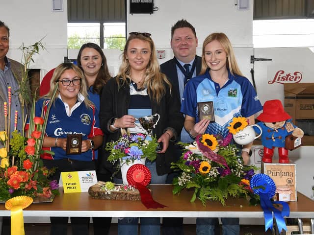 Winners of the 18-21 section in the floral art competition with judge, Gregory Baptie (left), Kerri Ann Curran, Power NI (left), YFCU president, Stuart Mills (right)