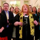 Naomi Long, pictured surrounded by her MLAs at Stormont; she has been quizzed online about how to define "woman"