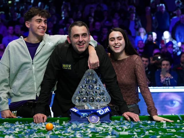 Ronnie O'Sullivan poses with the Paul Hunter trophy alongside his children, Ronnie Jr and Lily, after victory over Ali Carter in the MrQ Masters final at Alexandra Palace. (Photo by Bradley Collyer/PA Wire)