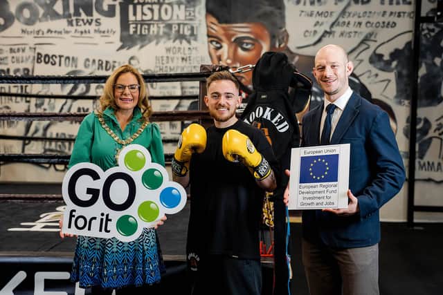 Belfast personal trainer and mental health advocate Jake McBride has turned his passion for fitness into a ‘knock-out’ business with the launch of his very own boutique boxing gym, Hooked Belfast, thanks to help from the Go For It programme in association with Belfast City Council. Pictured is Belfast Lord Mayor, councillor Christina Black, Jake McBride, owner of Hooked Belfast and Robbie Jamison, business advisor at East Belfast Enterprise