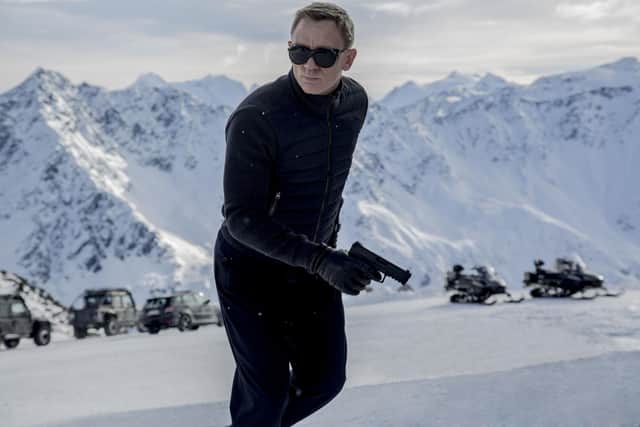 Daniel Craig as James Bond. S