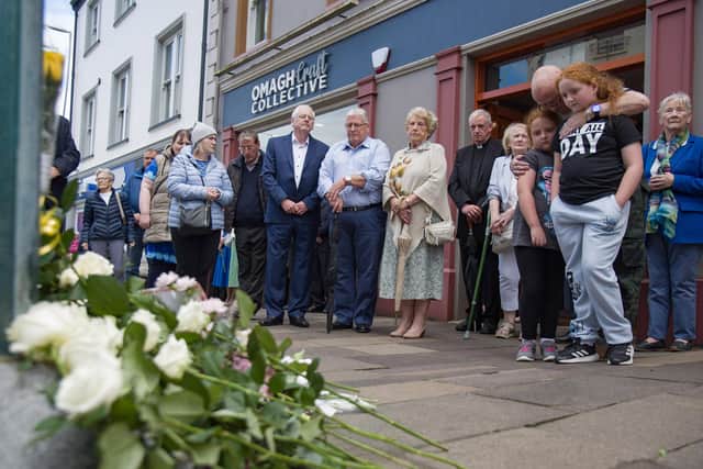 Relatives of those murdered in the Omagh bomb gather at the scene of the atrocity on the town's Market Street to mark the 25th anniversary of the Real IRA attack in August 1998. Photo: Pacemaker Belfast