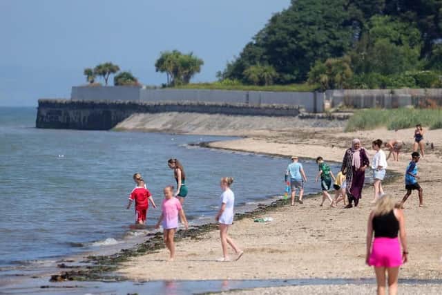 People pictured at Seamark in Co. Down enjoying the good weather on July 16 this year