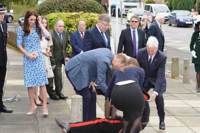 The Duke of Cambridge comes to the aid of Jonathan Douglas-Hughes, Vice Lord-Lieutenant of Essex when he took a tumble as he arrived at Stewards Academy in Harlow, Essex