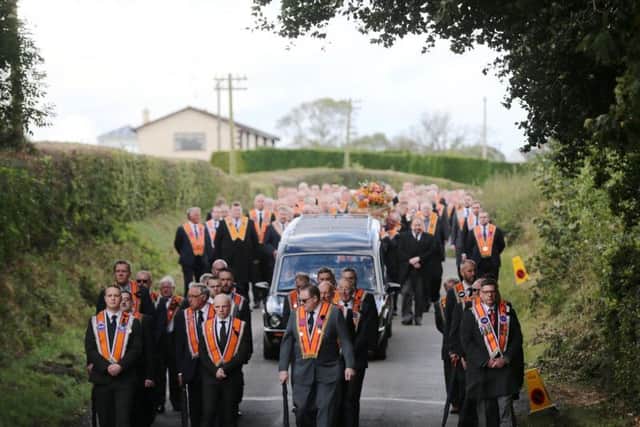 The funeral cortege for high profile Orangeman Drew Nelson makes its way to St John's Church, Hillsborough Co Down