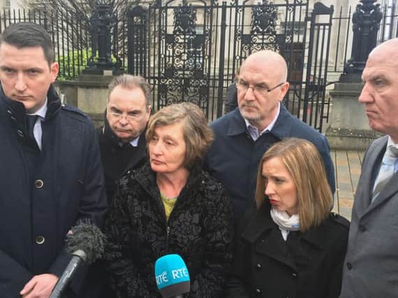 Widow of solicitor Pat Finucane, Geraldine Finucane (centre) with her son John (left) and daughter Katherine (second right), solicitor Peter Madden (second left) and Mr Finucane's brothers Seamus and Martin speaking outside the Royal Courts of Justice in Belfast, after the widow lost her challenge against the Government's refusal to hold a public inquiry into his murder by loyalist paramilitaries.