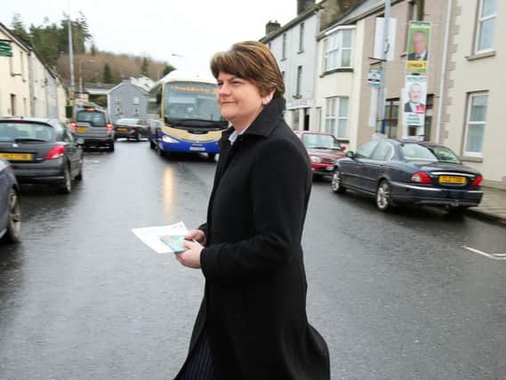 DUP leader Arlene Foster on her way cast her vote this morning.