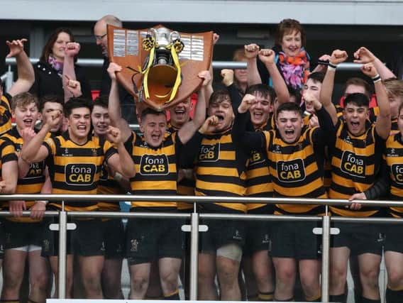 RBAI captain Michael Lowry lifts the Danske Bank Ulster School's Cup after defeating Methodist College 12-8   during the St Patrick's Day Danske Bank Ulster School's Cup Final at Kingspan Stadium, Ravenhill.
