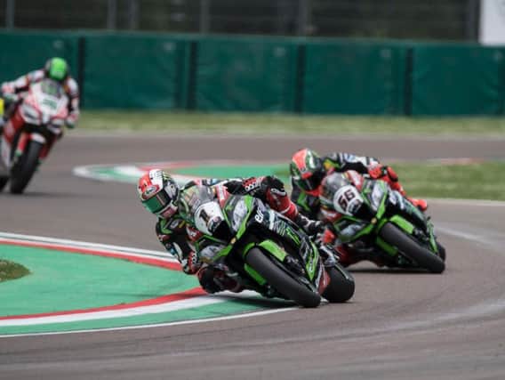 Jonathan Rea leads his Kawasaki team-mate Tom Sykes at Imola in Italy.