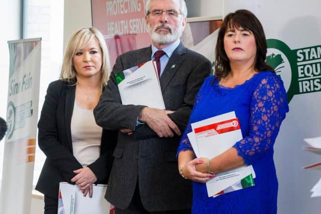 Sinn Fein's Northern Ireland leader Michelle O'Neill (left) with party President Gerry Adams and Michelle Gildernew
