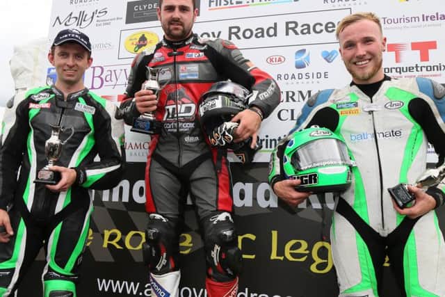 Michael Dunlop on the podium with runner-up Derek McGee (left) and Davey Todd following the Open Superbike race at Armoy.
