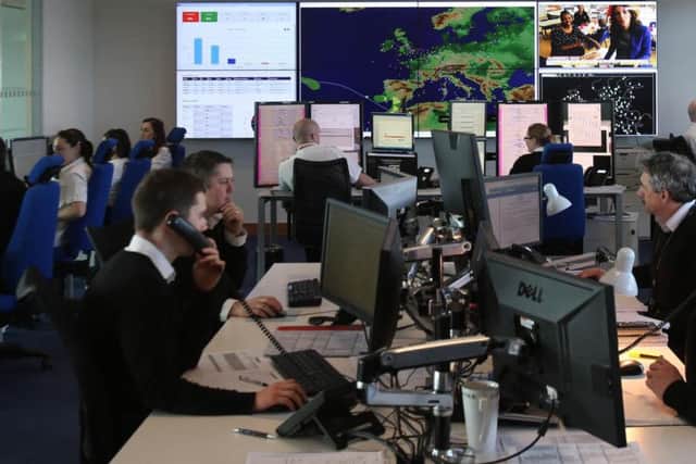 File photo dated 3/4/2014 of people at work in the Operations room at the Ryanair offices in Swords in Dublin. Ireland's aviation regulator has said Ryanair must offer alternative flights or a full refund if it cancels a service.