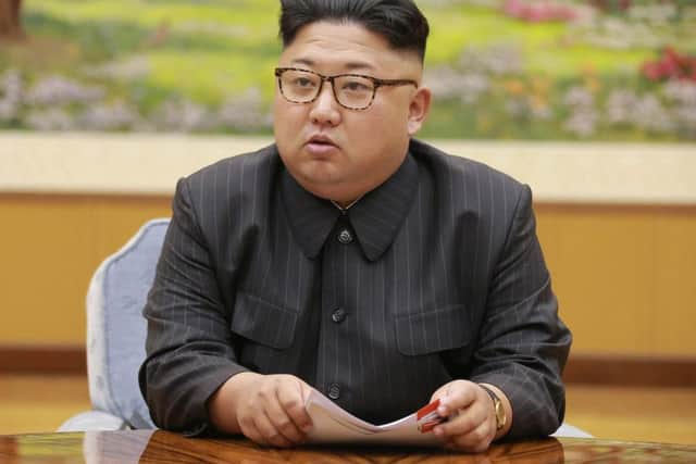 An  image distributed on Sept. 4, 2017, by the North Korean government, North Korea's leader Kim Jong Un holds a meeting of the ruling party's presidium. Kim is calling President Donald Trump "deranged" and says in a statement carried by the state news agency that he will "pay dearly" for his threats. The statement, carried by North's official Korean Central News Agency, responds to Trump's combative speech at the U.N. General Assembly on Tuesday, Sept. 19.