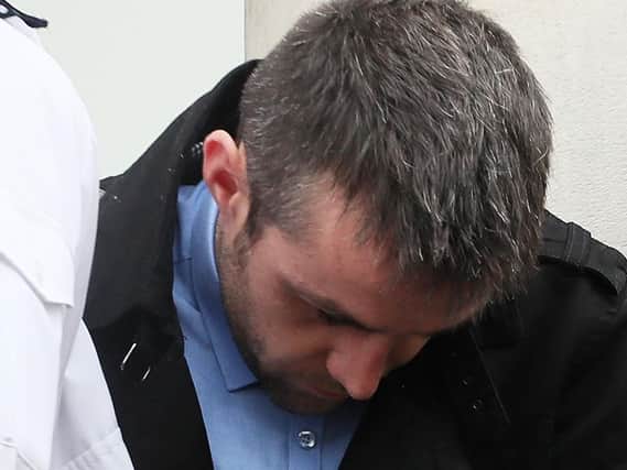 Padraig Toher, 27, of Bawnboy Ballyconnell in Cavan, is led away in handcuffs as he leaves Enniskillen Magistrates Court after he appeared in court charged with the manslaughter of young mother, 23-year-old Natasha Carruthers, in a car crash near Derrylin earlier this month