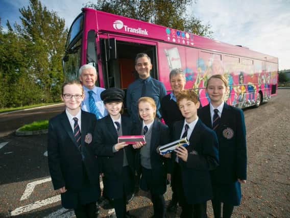 Translinks new Safety Bus can visit approximately 350 schools, or up to 25 thousand students, across Northern Ireland each academic year. Pictured at Aquinas Diocesan Grammar School in Belfast are Year 8 student Sarah McWilliams; Kevin Wallace, Safety Bus; Year 8 pupil Hannah Wilson; Sean McGreevy, Metro Falls Service Delivery Manager; Erin Watson, Year 8 student ; Susan ONeill, Safety Bus; and Year 8 students Oscar Feron and Kate McWilliams