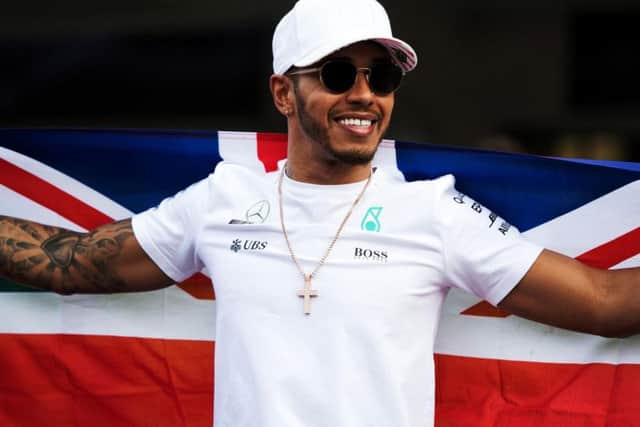 Mercedes' Lewis Hamilton celebrates winning the Formula One drivers' championship during the Mexican Grand Prix at the Autodromo Hermanos Rodriguez, Mexico City