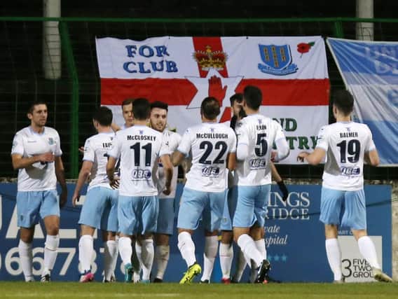 Ballymena players celebrate Cathair Friel's penalty