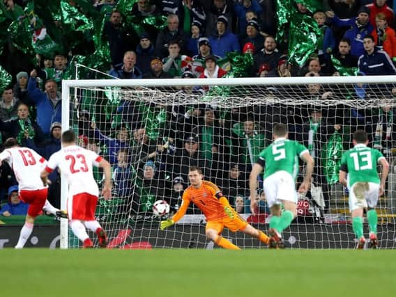 Ricardo Rodriguez scores from the spot after a controversial penalty award in the first leg of the World Cup play-off at Windsor Park