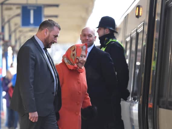 Queen Elizabeth II boards a train at King's Lynn railway station in Norfolk, as she returns to London after spending the Christmas period at Sandringham House in North Norfolk