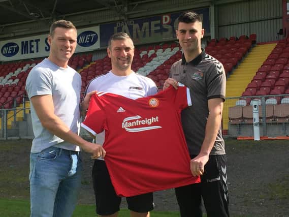 Portadown manager Matthew Tipton (centre) with the club's latest signings, from left, Kevin Braniff and Johnny Flynn.