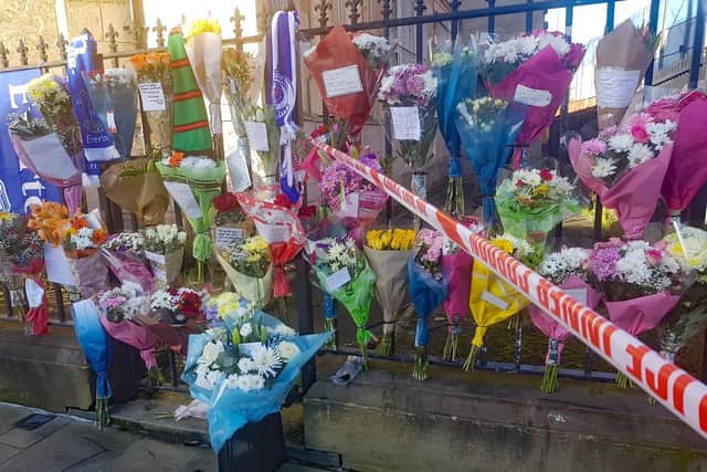 Floral tributes left near at the scene in east Belfast where community worker Ian Ogle was murdered on Sunday night.