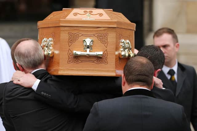 The coffin of Lyra McKee is carried inside the cathedral.