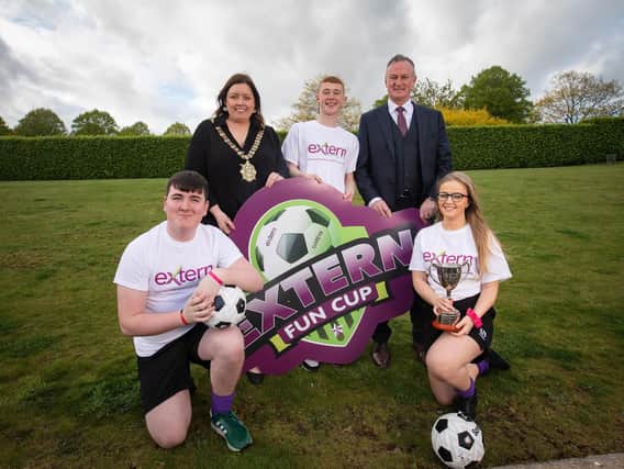 Northern Ireland football manager Michael ONeill and outgoing Belfast Lord Mayor Deirdre Hargey with Extern service users Declan Gill, Gerard McLarnon and Colleen McStravick.