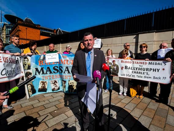 John Teggart of the Ballymurphy families reading a statement to the media on behalf of the families of those killed in shootings involving the parachuted regiment in Ballymurphy West Belfast 1971, during protest at the visit of the Prince of Wales, the regiment's commander-in-chief, to Belfast.