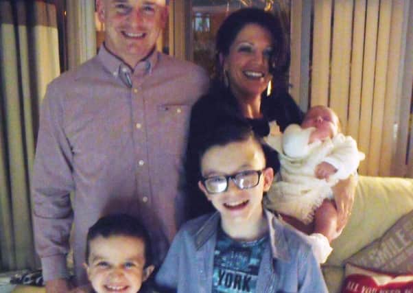 Undated family handout photo issued by the Garda of Sean McGrotty, with his partner Louise holding their baby, four-month-old Rionaghac-Ann and his sons Mark, 12, (right) and Evan, eight