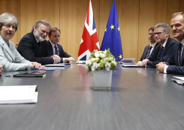 Far apart: UK Prime Minister Theresa May, left, meets with European Council President Donald Tusk, right, on the sidelines of an Eastern Partnership Summit in Brussels, on Friday. Mr Tusk and other EU leaders seem to be backing the hardline Dublin position on the Irish border. (Christian Hartmann, Pool Photo via AP)