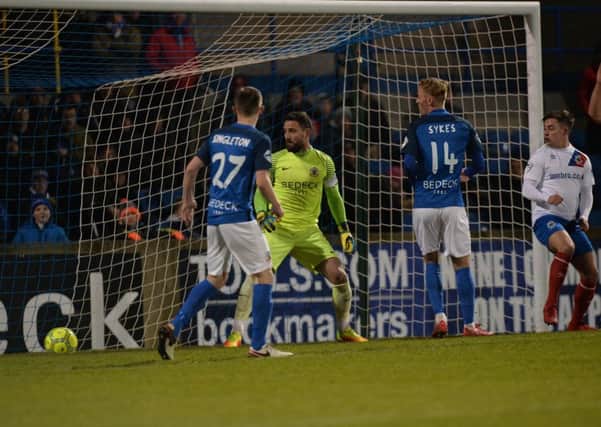 Cameron Stewart's first-half header drops over the line to seal success for Linfield over Glenavon. Pic by Pacemaker.