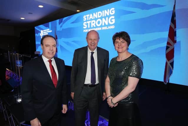 Nigel Dodds and Arlene Foster with the de   facto deputy Prime Minister, Damian Green, at the DUP conference fund-raising dinner on Friday night.

Photo by Kelvin Boyes/Press Eye