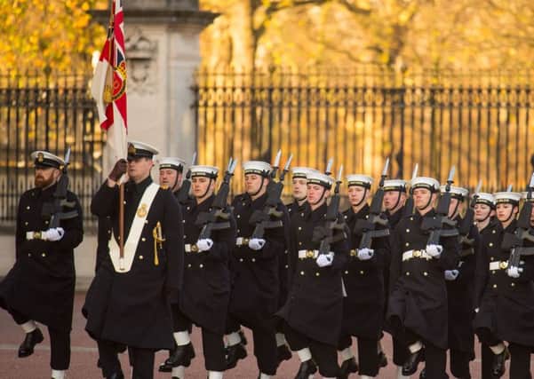Sailors from the Royal Navy perform the Changing of the Guard ceremony at Buckingham Palace, London, for the first time in its 357-year history. PRESS ASSOCIATION Photo. Picture date: Sunday November 26, 2017. Eighty-six sailors from 45 Royal Navy ships and establishments have spent a month learning the intricate routines, and have now been deemed ready to perform the ceremony for real. The ceremony - performed since the restoration of King Charles II in 1660 - is traditionally performed by one of the five Foot Guards Regiments from the army's Household Division. See PA story ROYAL Sailors. Photo credit should read: Dominic Lipinski/PA Wire