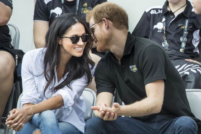 File photo dated 25/09/17 of Prince Harry and Meghan Markle watching Wheelchair Tennis at the 2017 Invictus Games in Toronto, Canada, as they have announced their engagement