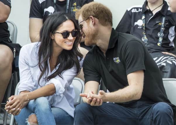 File photo dated 25/09/17 of Prince Harry and Meghan Markle watching Wheelchair Tennis at the 2017 Invictus Games in Toronto, Canada, as they have announced their engagement