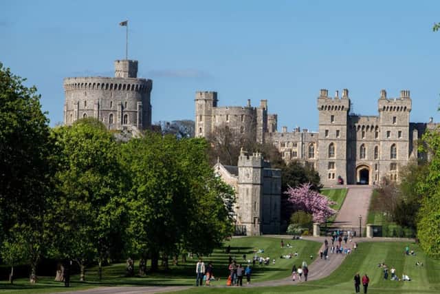 File photo dated 15/4/2014 of tourists and local residents enjoy the sunshine on the Long Walk at Windsor Castle in Berkshire.