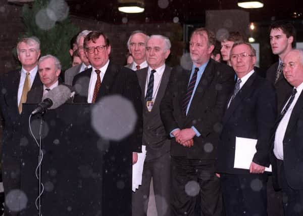 1998:  The snow starts to fall as Ulster Unionist party leader David Trimble, backed by his negotiating team, announces to the gathered media that the Good Friday Agreement had been signed