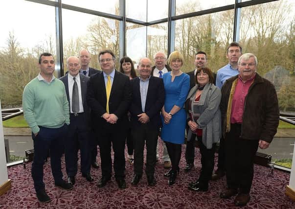Alliance deputy leader 
Stephen Farry (fourth left) with members of the Victims Forum at Stormont Hotel in Belfast