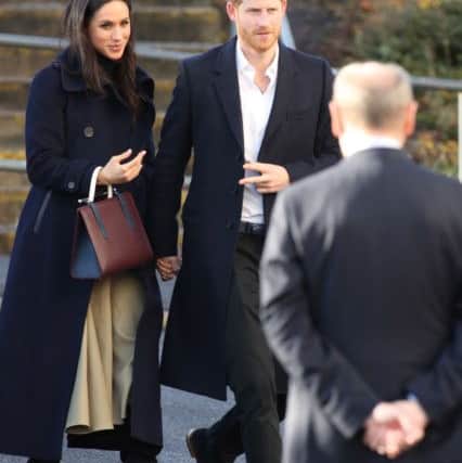 Prince Harry and Meghan Markle arriving at the Nottingham Academy