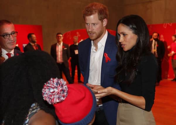 Prince Harry and Meghan Markle attend a Terrence Higgins Trust World AIDS Day charity fair, during a visit to Nottingham, on their first official engagement together.