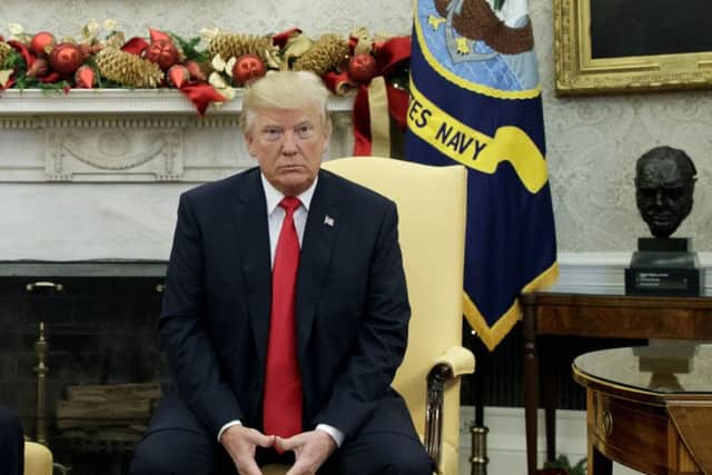 President Donald Trump in the Oval Office of the White House, Thursday, Nov. 30. Dealing with the unprecedented nature of his presidency is another of Theresa May's huge challenges (AP Photo/Evan Vucci)