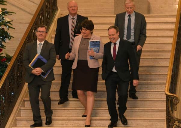 DUP leader Arlene Foster with several of her MPs at Stormont on Monday, where she explained the party's rejection of the proposed EU-UK wording on the Irish border. 
Pic Colm Lenaghan/Pacemaker