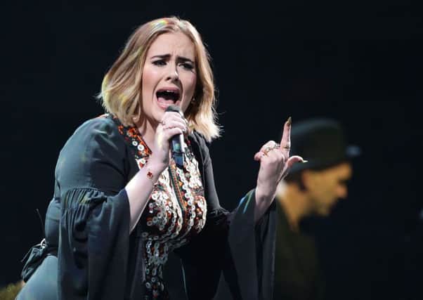 File photo dated 25/6/16 of Adele who has backed survivors of the Grenfell Tower disaster in calling for Theresa May to take urgent action to restore their faith in the inquiry