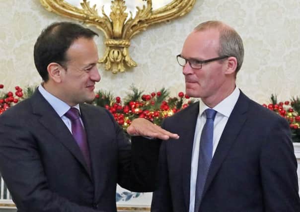 Taoiseach Leo Varadkar (left) with his deputy Simon Coveney (right), both of Fine Gael. Micheal Martin meanwhile is leader of Fianna Fail.