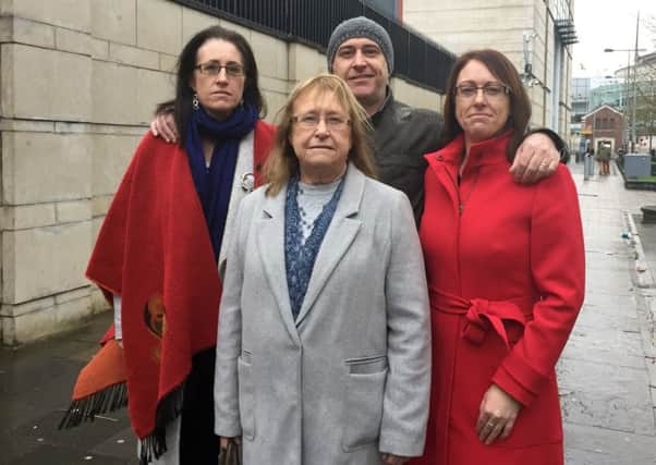 Members of Joe McCann's family,  (back row) children Aine, Feargal and Nuala with widow Anne (front) outside Belfast Magistrates' Court where two former soldiers accused of murdering an Official IRA commander in Northern Ireland are asking for their identities to be withheld during court proceedings