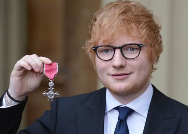 Singer Ed Sheeran with his MBE (Member of the Order of the British Empire) medal that was presented to him  by the Prince of Wales during an Investiture ceremony at Buckingham Palace, London